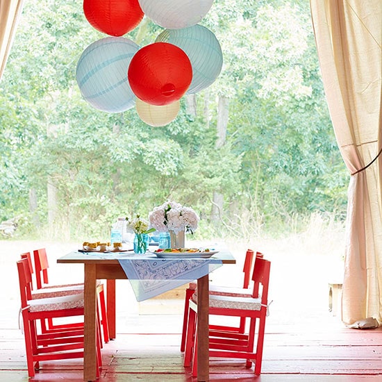 Rustic flare and colorful chairs are perfect for this kids 4th of July table