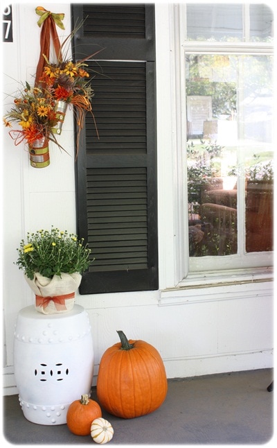 10 Fall Front Porch Decorating Ideas by A Blissful Nest - This front porch fall decor is subtle and colorful; quiet fall statement that complements the white-washed house. 
