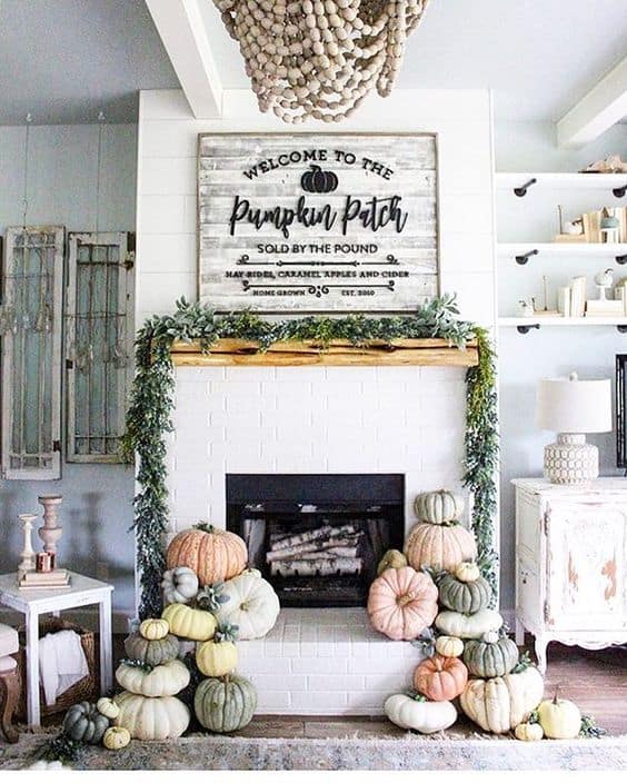 Love the cluster of pumpkins and sign on the fall mantel