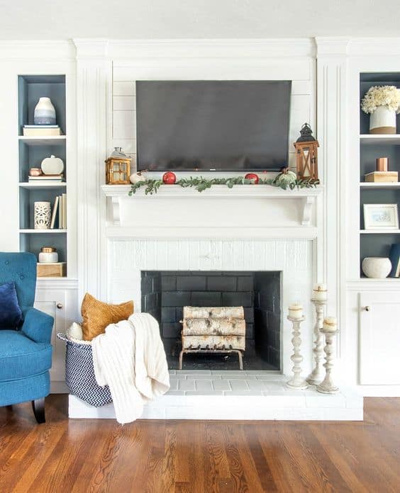 Love how beautiful the blue pops with this simple fall mantel decor.