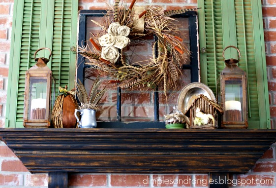 A beautiful faux fall mantel with a pop of green in these vintage shutters.