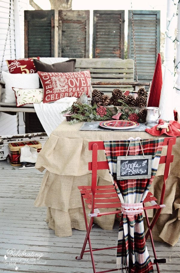 Celebrating Everyday Life Christmas Porch porch swing, Christmas Pillows, Plaid blanket, Pine Cones - christmas porch ideas