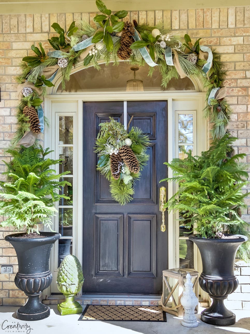Gorgeous garland and oversized urns make this a gorgeous Christmas porch! #christmasporch #Christmasdecor #Christmasideas