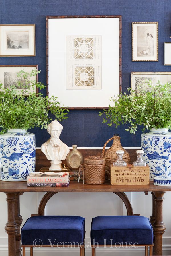 Gorgeous blue and white vases make this navy wall pop!