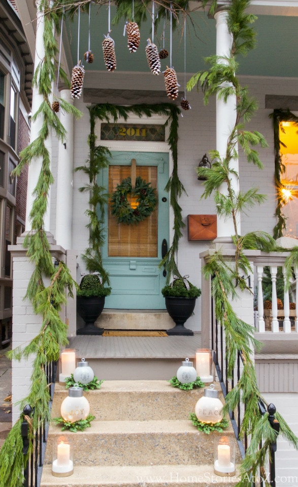 Home Stories A to Z Christmas Porch, candles, hanging pine cones - Christmas porch ideas from A Blissful Nest