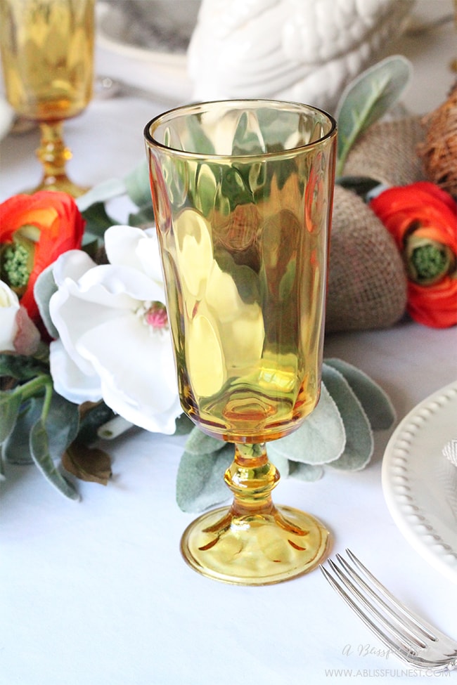 Use colored glasses to make your table setting for Thanksgiving pop!