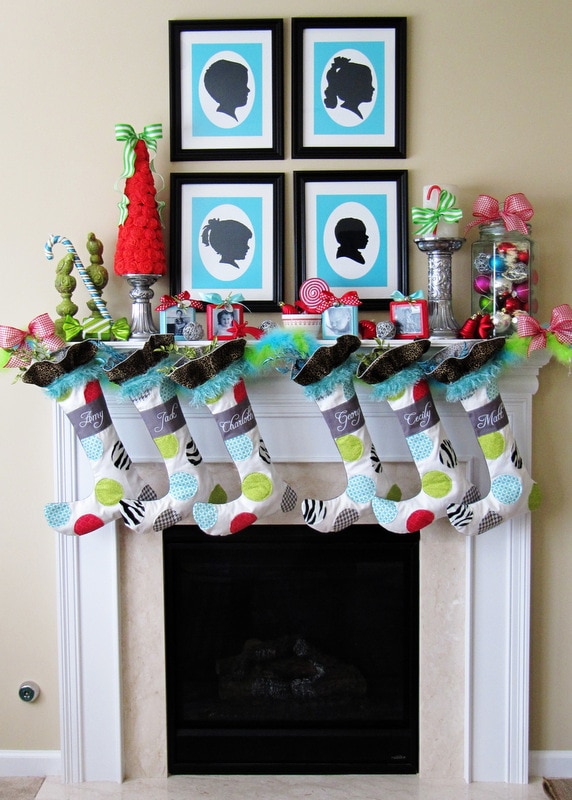 Christmas mantels - colorful mantel with blue, white, and red stockings, red christmas tree, colorful ornaments - Christmas Mantel Positively Splendid