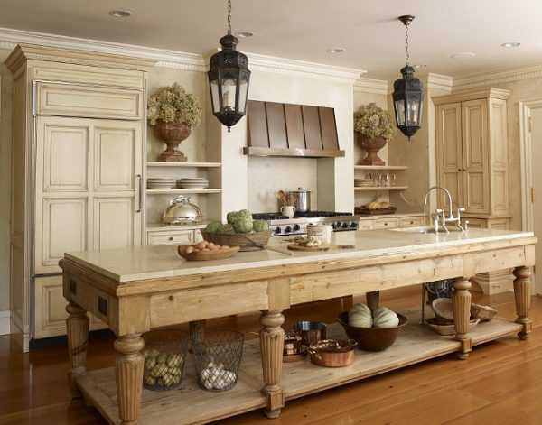 Honey oak kitchen island color with soft beige cram cabinets. 