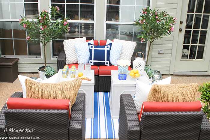 If you've got a small patio then you are not alone. BUT you do not have to sacrifice that designer look because of space issues. We are showing you simple tips to get that designer look with these small patio solutions. Via A Blissful Nest https://ablissfulnest.com #patiodecor #backyarddecor #homedecor #interiordesign #designtips