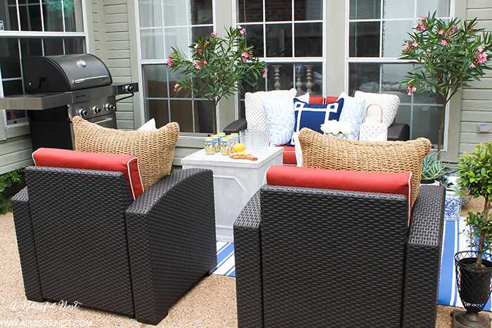 If you've got a small patio then you are not alone. BUT you do not have to sacrifice that designer look because of space issues. We are showing you simple tips to get that designer look with these small patio solutions. Via A Blissful Nest https://ablissfulnest.com #patiodecor #backyarddecor #homedecor #interiordesign #designtips