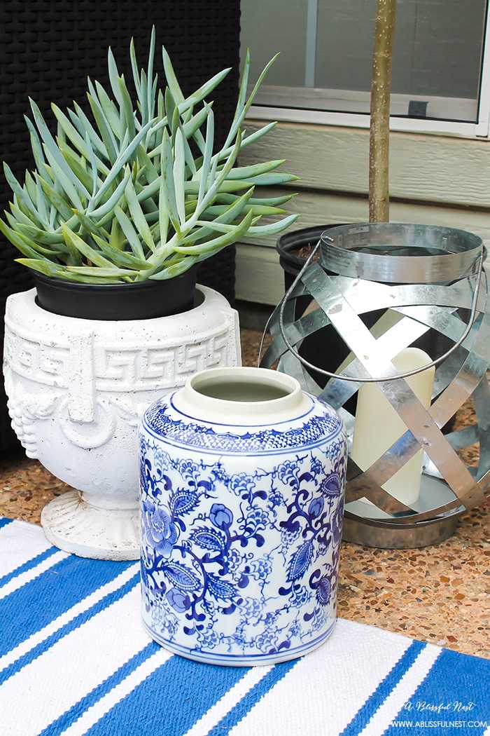 If you've got a small patio then you are not alone. BUT you do not have to sacrifice that designer look because of space issues. We are showing you simple tips to get that designer look with these small patio solutions. Via A Blissful Nest https://ablissfulnest.com #patiodecor #backyarddecor #homedecor #interiordesign #designtips