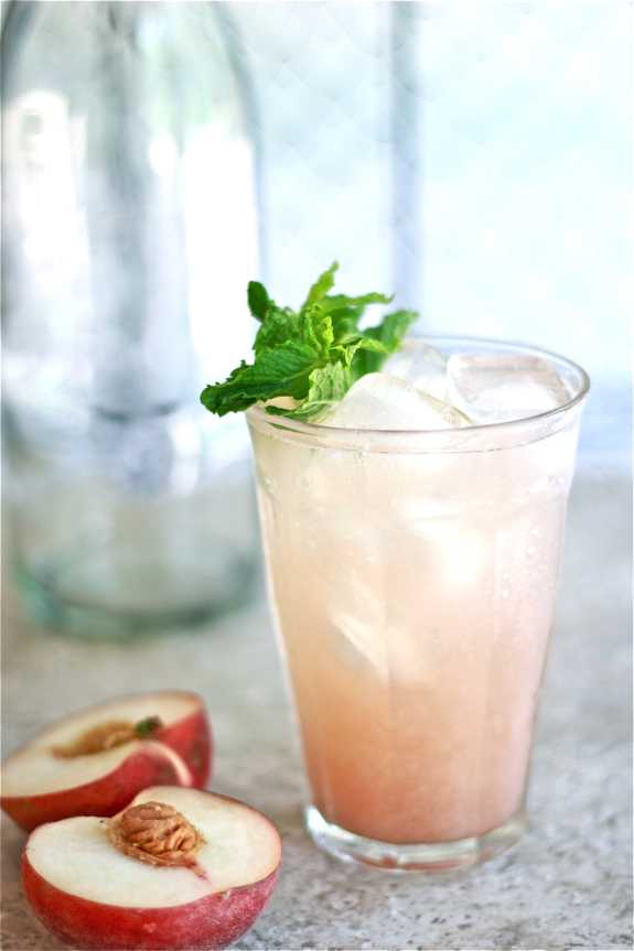 White Peach Cooler Cocktail, 20 Best Summer Cocktails via A Blissful Nest
