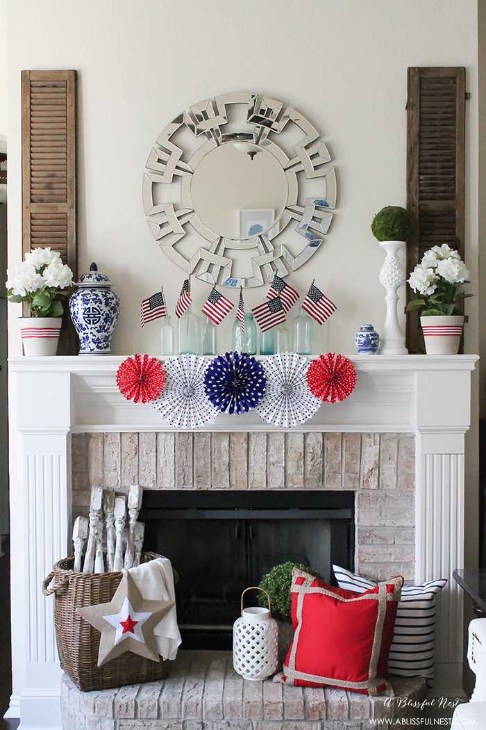 I adore the vintage Americana 4th of July mantle decor! With pops of aqua this is the perfect 4th of July decor by A Blissful Nest. https://ablissfulnest.com #4thofjuly #redwhiteandblue #4thofjulydecor