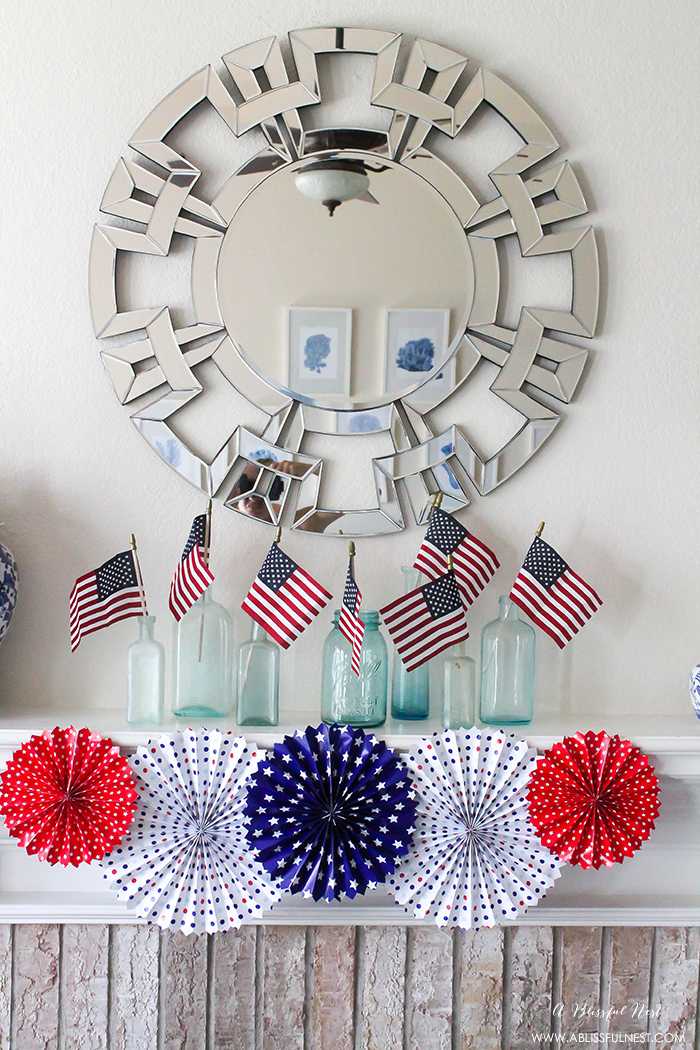 I adore the vintage Americana 4th of July mantle decor! With pops of aqua this is the perfect 4th of July decor by A Blissful Nest. https://ablissfulnest.com #4thofjuly #redwhiteandblue #4thofjulydecor