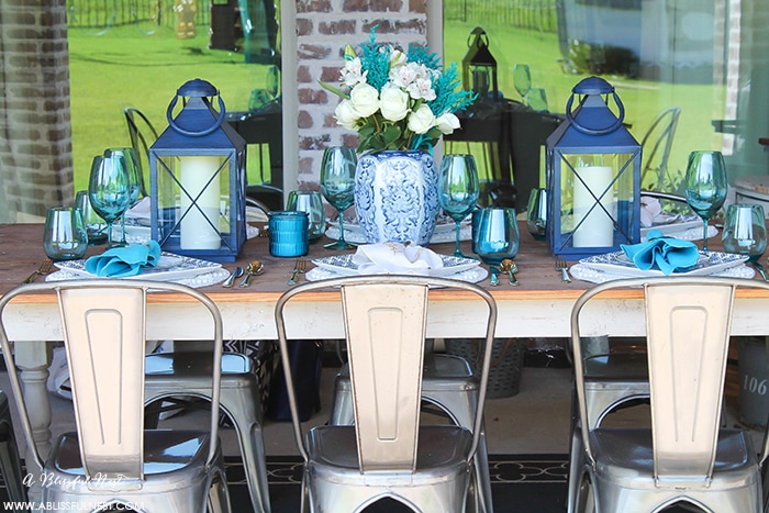 Fresh coastal table décor ideas for the perfect summer night. Grab these tips on setting the perfect coastal tablescape by A Blissful Nest. https://ablissfulnest.com/ #coastal #tabledecor #tabledecorideas #coastalinteriors #coastalroom #ocean #blueandwhite