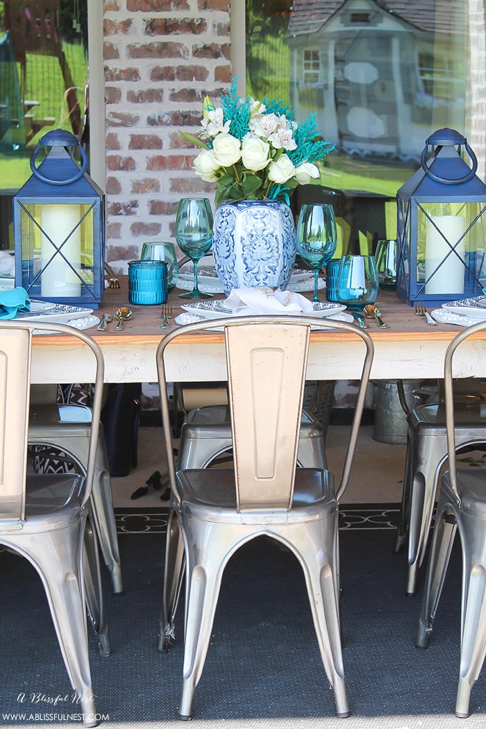 Fresh coastal table décor ideas for the perfect summer night. Grab these tips on setting the perfect coastal tablescape by A Blissful Nest. https://ablissfulnest.com/ #coastal #tabledecor #tabledecorideas #coastalinteriors #coastalroom #ocean #blueandwhite