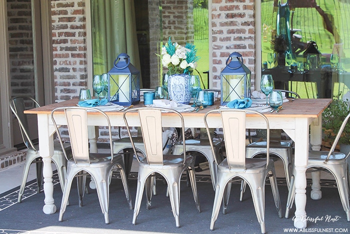 Fresh coastal table décor ideas for the perfect summer night. Grab these tips on setting the perfect coastal tablescape by A Blissful Nest. https://ablissfulnest.com/ #coastal #tabledecor #tabledecorideas #coastalinteriors #coastalroom #ocean #blueandwhite