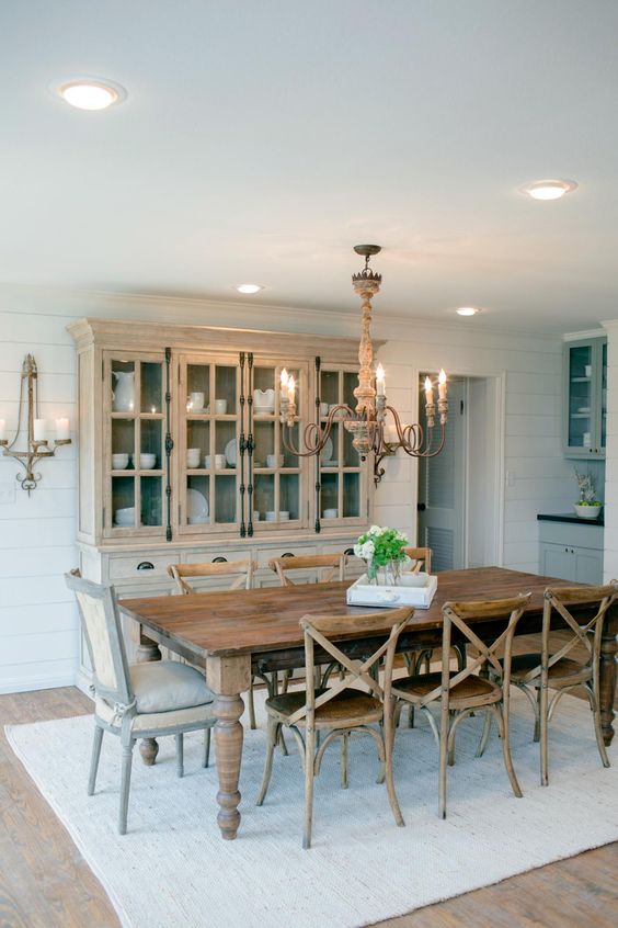 Different wood finishes in this dining room add texture without being too overwhelming, and this dining table can sit up to 8! HGTV Country House in a very Small Town, 20 Best Fixer Upper Rooms via A Blissful Nest