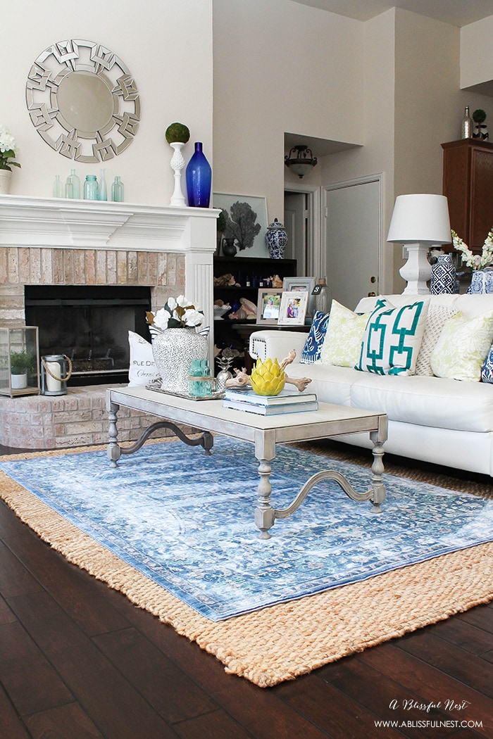 It’s time for a change! Show some designer flare and learn how to layer rugs like a pro. The designers all do it for a reason. It makes BIG impact. Make your room pop with these 5 simple tips from A Blissful Nest. https://ablissfulnest.com/ #rugideas #designtips #homedecortips #livingroom #livingroomideas