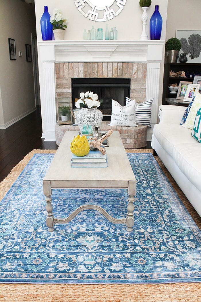 It’s time for a change! Show some designer flare and learn how to layer rugs like a pro. The designers all do it for a reason. It makes BIG impact. Make your room pop with these 5 simple tips from A Blissful Nest. https://ablissfulnest.com/ #rugideas #designtips #homedecortips #livingroom #livingroomideas