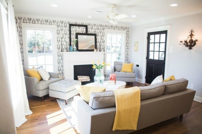 This cozy living room makes a statement with bold wallpaper and stunning black, yellow, and neutral colored accents. Magnolia Market The Chicken House, 20 Best Fixer Upper Rooms 