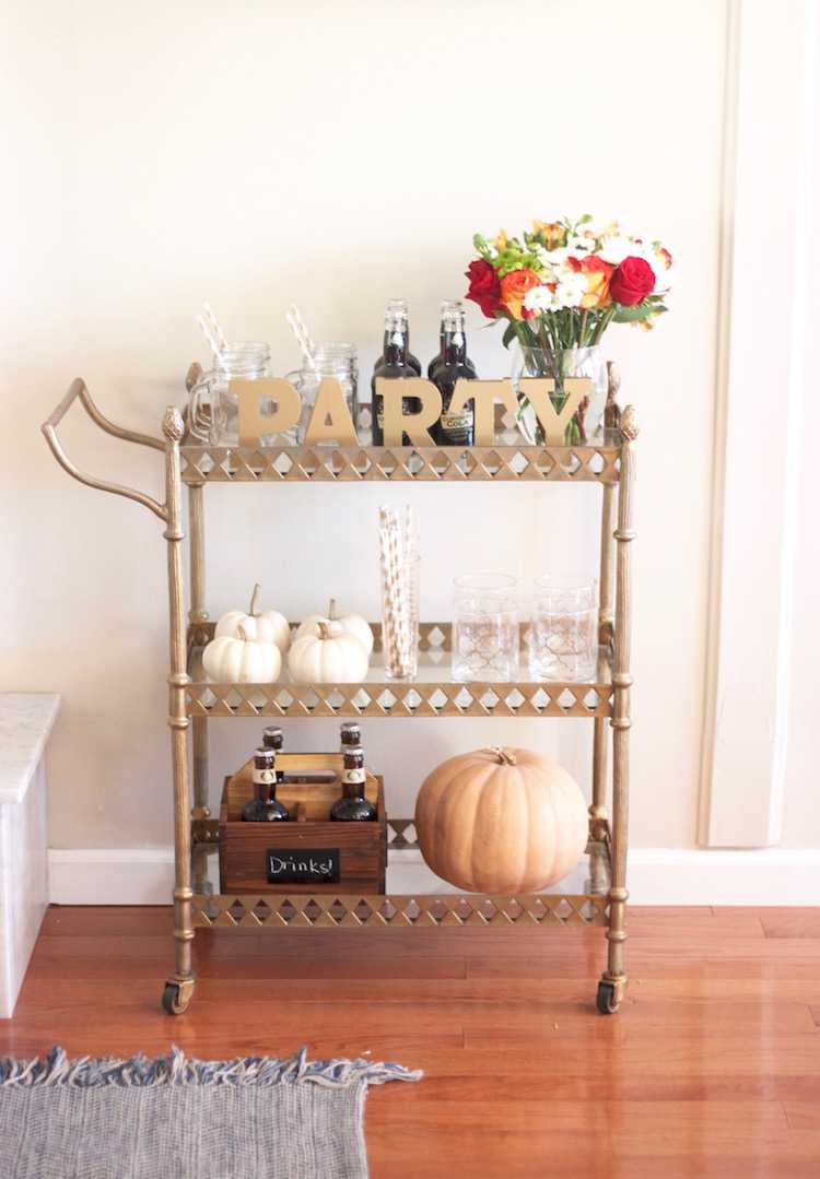 This festive fall bar cart is perfect for any entertaining occasion or even a quiet evening at home. Be prepared for anyone who may stop by, too! Seen on https://ablissfulnest.com/ #fall #entertaining #barcart
