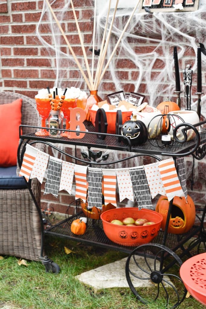 This Halloween Bar Cart isn't only for adults, this adorable cart is kid-friendly and oh so fun! Such a great way to celebrate this fun holiday! https://ablissfulnest.com/ #Halloween #Entertaining #HalloweenParty