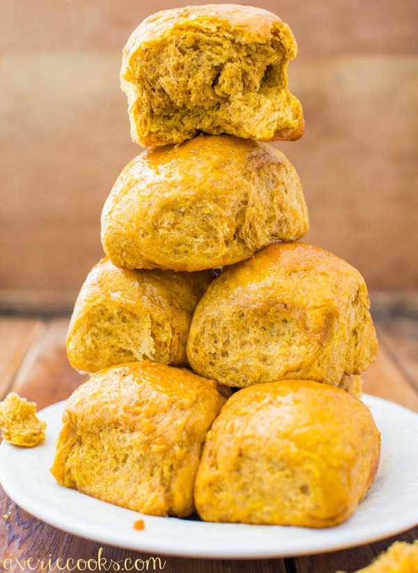 Honey Butter Pumpkin Dinner Rolls |25 Pumpkin Recipes that you need to try this fall! From french toast to cupcakes, there is a pumpkin recipe for everyone! https://ablissfulnest.com/ #pumpkin #recipes #fall
