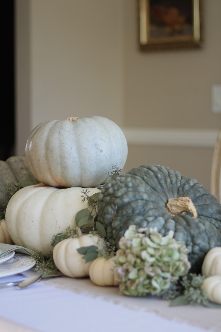 This neutral Fall tablescape is full of natural elements, brown toile dishes and loads of pumpkins and dried florals. Visit https://ablissfulnest.com/ for all of the details! #NeutralDecor #Fall #FallTablescape
