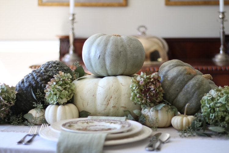 This neutral Fall tablescape is full of natural elements, brown toile dishes and loads of pumpkins and dried florals. Visit https://ablissfulnest.com/ for all of the details! #NeutralDecor #Fall #FallTablescape