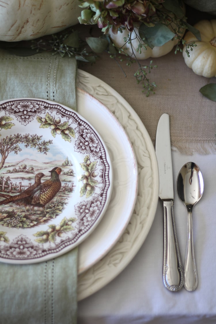 This neutral Fall tablescape is full of natural elements, brown toile dishes and loads of pumpkins and dried florals. Visit https://ablissfulnest.com/ for all of the details! #NeutralDecor #Fall #FallTablescape