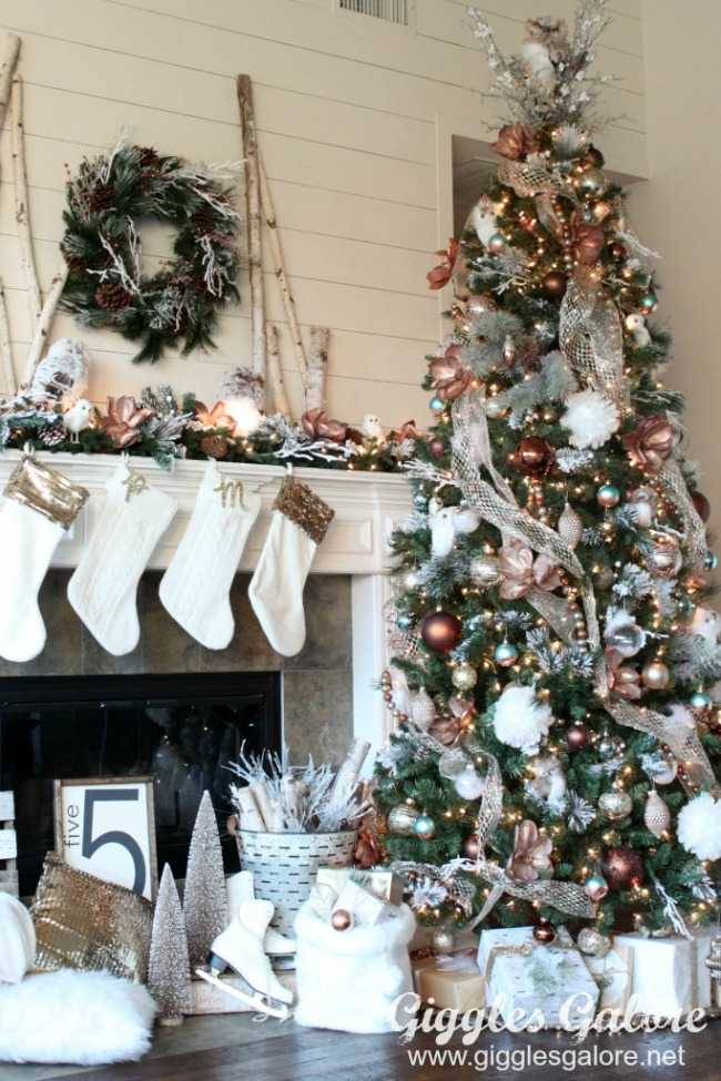 A metallic brass themed Christmas tree shows that darker neutral colors can still sparkle when mixed with wisps of white ribbon and shining ornaments