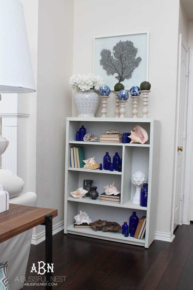 Got an old bookcase that needs to be updated? Checkout how this bookcase went from boring to fabulous with just a few easy steps! See more on https://ablissfulnest.com/ #bookcasemakeover #diybookcase #chalkfurniturepaint