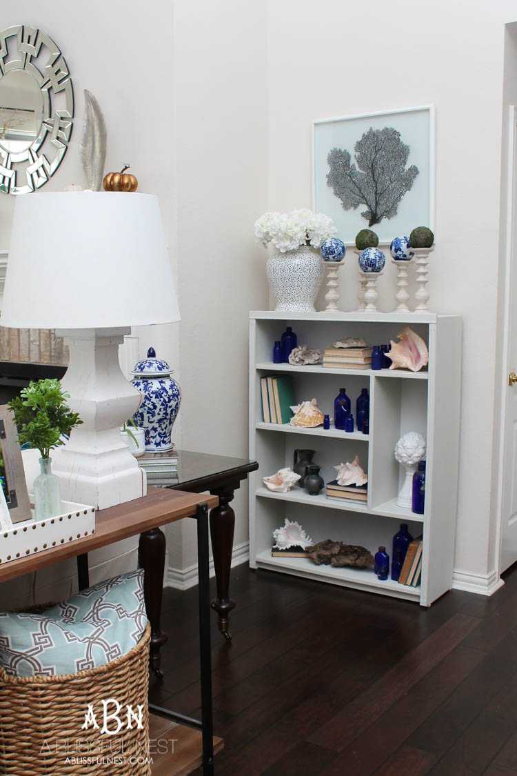 Got an old bookcase that needs to be updated? Checkout how this bookcase went from boring to fabulous with just a few easy steps! See more on https://ablissfulnest.com/ #bookcasemakeover #diybookcase #chalkfurniturepaint