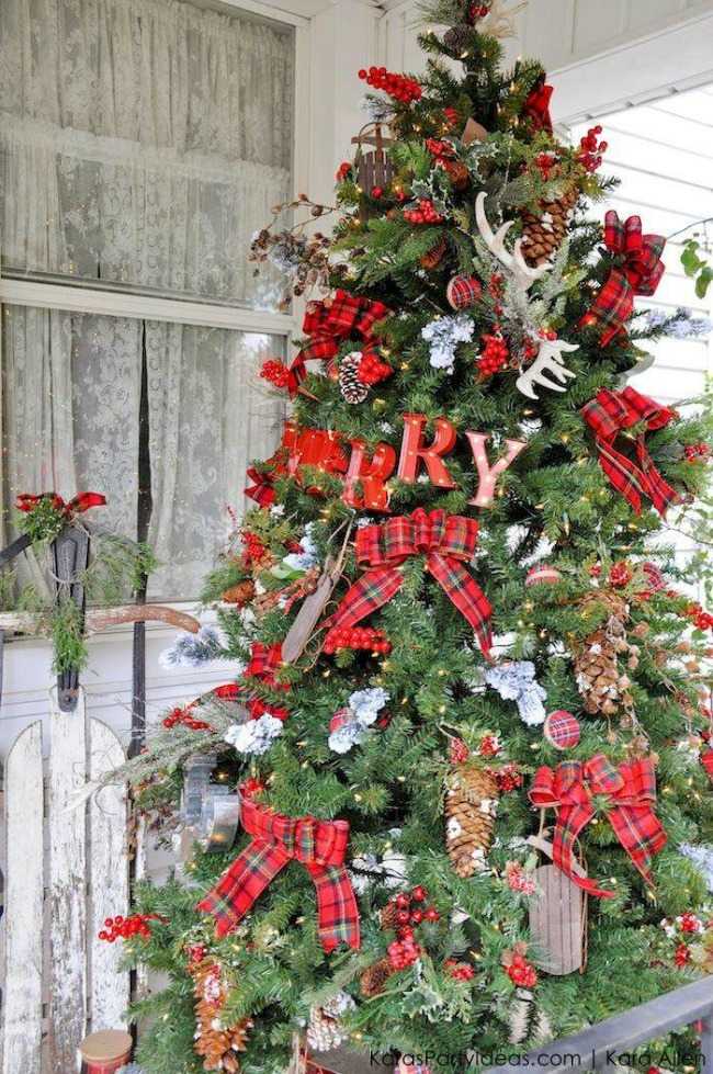 This mountain getaway tree is accented with rustic plaid and farmhouse decorations to look like this tree came straight out of your Up North cabin