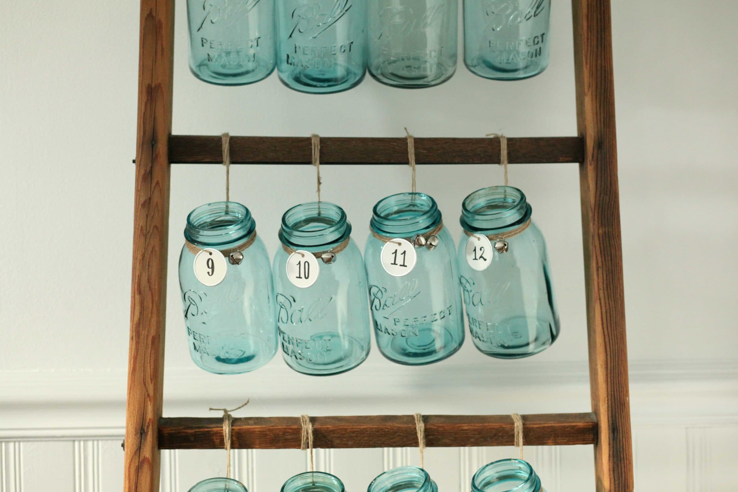 Beautiful Christmas decor using a Vintage Ladder for a Mason Jar Advent Calendar. So festive and fun! See more on https://ablissfulnest.com/ #Christmas #Advent #ChristmasDecor