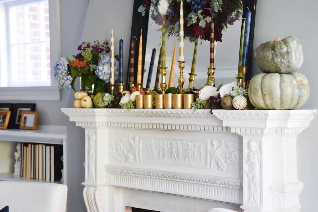 Learn how to make your own striped taper candles and painted votive candle holders for any occasion. A gorgeous Thanksgiving mantel brimming with color. See it all at https://ablissfulnest.com/ #Thanksgiving #DIY #HolidayDIY