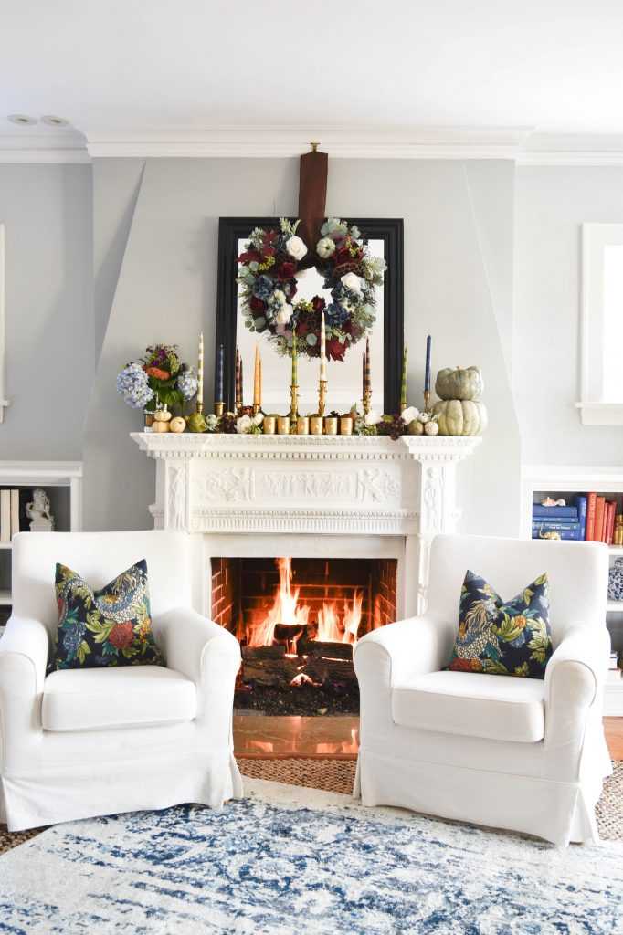 Learn how to make your own striped taper candles and painted votive candle holders for any occasion. A gorgeous Thanksgiving mantel brimming with color. See it all at https://ablissfulnest.com/ #Thanksgiving #DIY #HolidayDIY