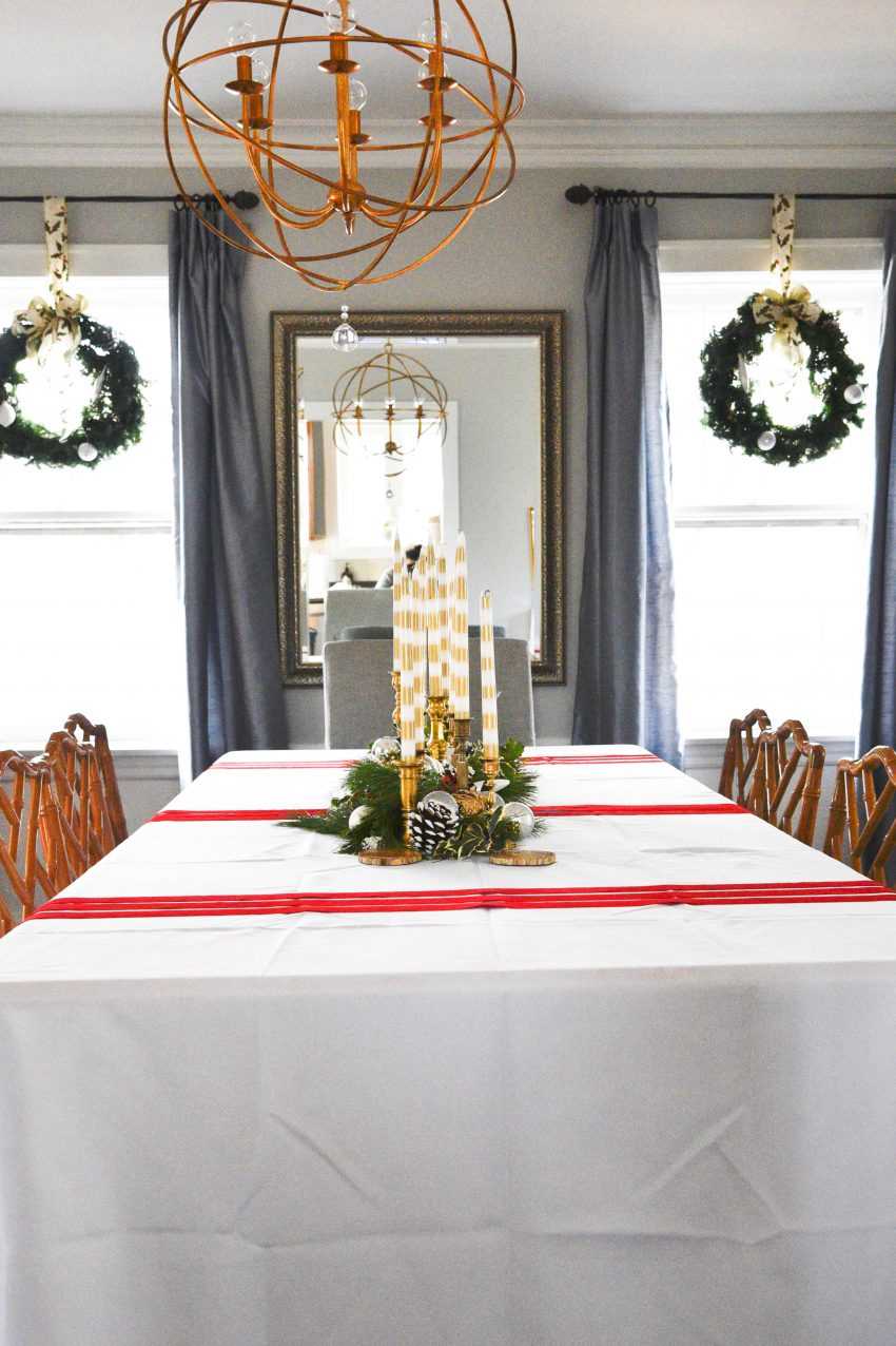 Here are some amazing tips to create the most beautiful budget Christmas Tablescape. You are going to wow your guests! See it all on https://ablissfulnest.com// #Christmas #BudgetDecor #ChristmasTablescape