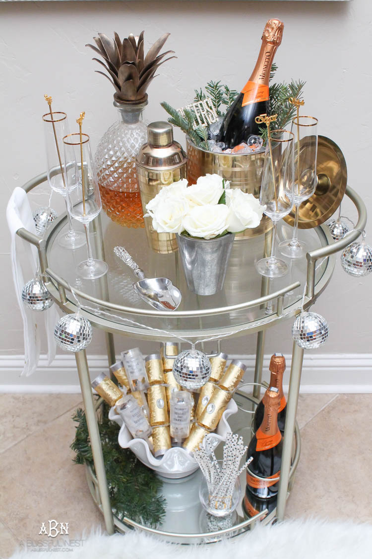 These are such great ideas to transition your Christmas décor into celebrating New Years Eve! Love all the gold and sparkly accents! See more on https://ablissfulnest.com/ #newyearseve #newyearsbarcart #ad #Pier1Love