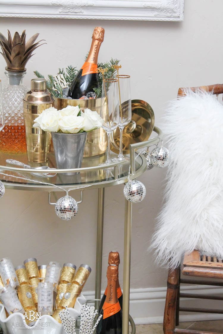 These are such great ideas to transition your Christmas décor into celebrating New Years Eve! Love all the gold and sparkly accents! See more on https://ablissfulnest.com/ #newyearseve #newyearsbarcart #ad #Pier1Love