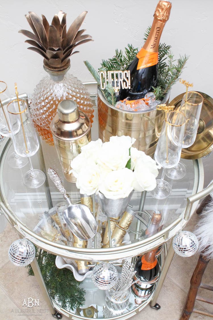 These are such great ideas to transition your Christmas décor into celebrating New Years Eve! Love all the gold and sparkly accents! See more on https://ablissfulnest.com/ #newyearseve #newyearsbarcart #ad #Pier1Love