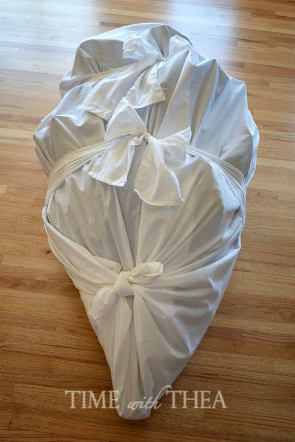 Christmas Decoration Storage solutions - spare sheets can be used to wrap and store fake christmas trees.