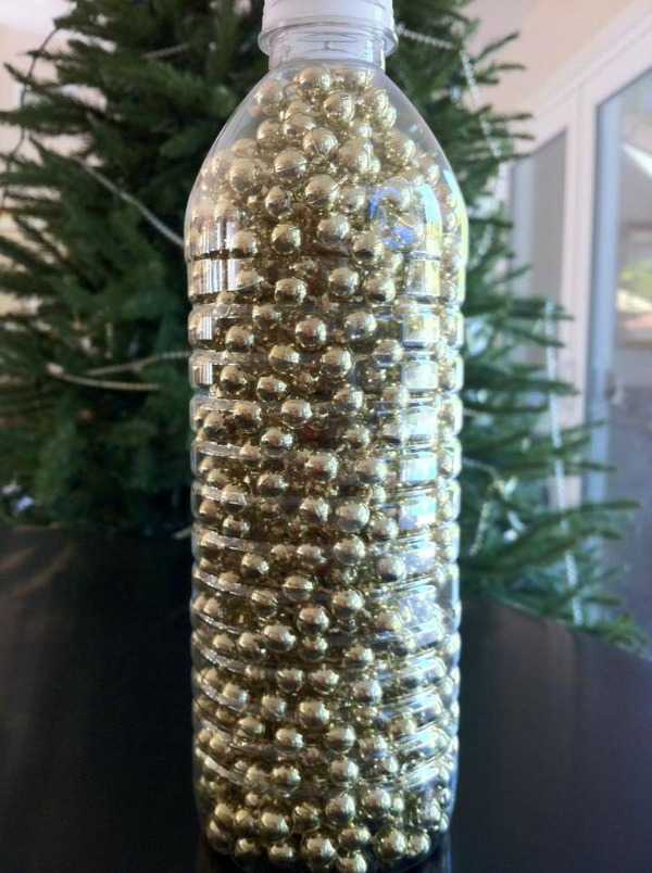 Christmas Decoration Storage - use plastic bottles to store bead garland. 