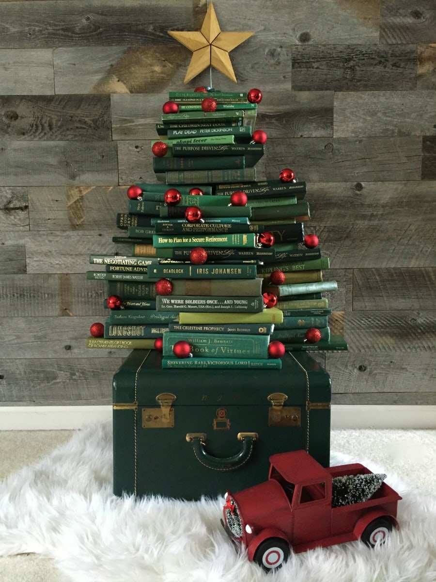 Collect Books for a DIY vintage inspired book Christmas tree. See how to make it at https://ablissfulnest.com/ #Christmas #ChristmasDecor #DecoratingWIthBooks