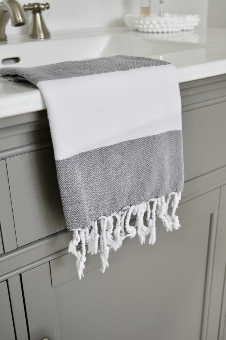 New linens are the perfect way to refresh your home. This grey and white striped throw can be used as a towel, blanket, or decorative piece anywhere in your home.