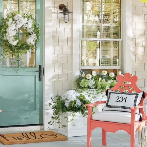 Love the color pops on this spring front porch! #spring #springporch #springdecorating #springfrontporch