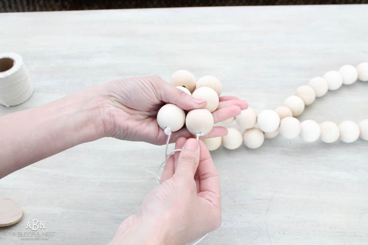 I can not believe how expensive prayer beads normally are! This DIY farmhouse wood prayer beads tutorial is so easy to make and only cost $30. What an amazing and easy DIY Farmhouse decor project! See more on https://ablissfulnest.com/ #farmhousedecor #farmhousestyle