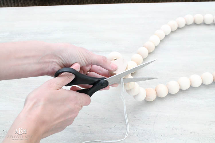 I can not believe how expensive prayer beads normally are! This DIY farmhouse wood prayer beads tutorial is so easy to make and only cost $30. What an amazing and easy DIY Farmhouse decor project! See more on https://ablissfulnest.com/ #farmhousedecor #farmhousestyle