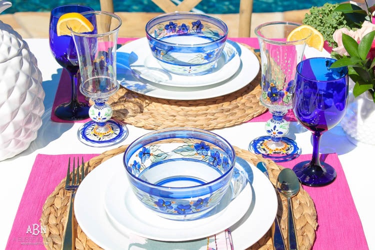 A bright and fresh spring table setting idea perfect for Easter, Mother's Day or a pool party! See more on https://ablissfulnest.com/ #tablesetting #tablescape #springtabledecor 